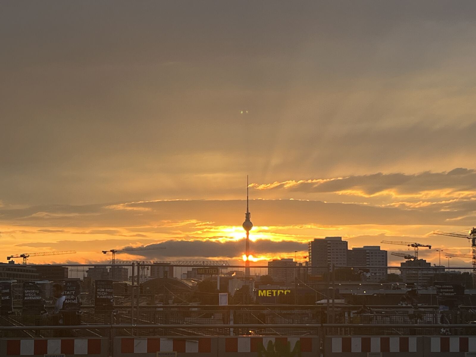 Berlin's TV tower silhouetted at sunset