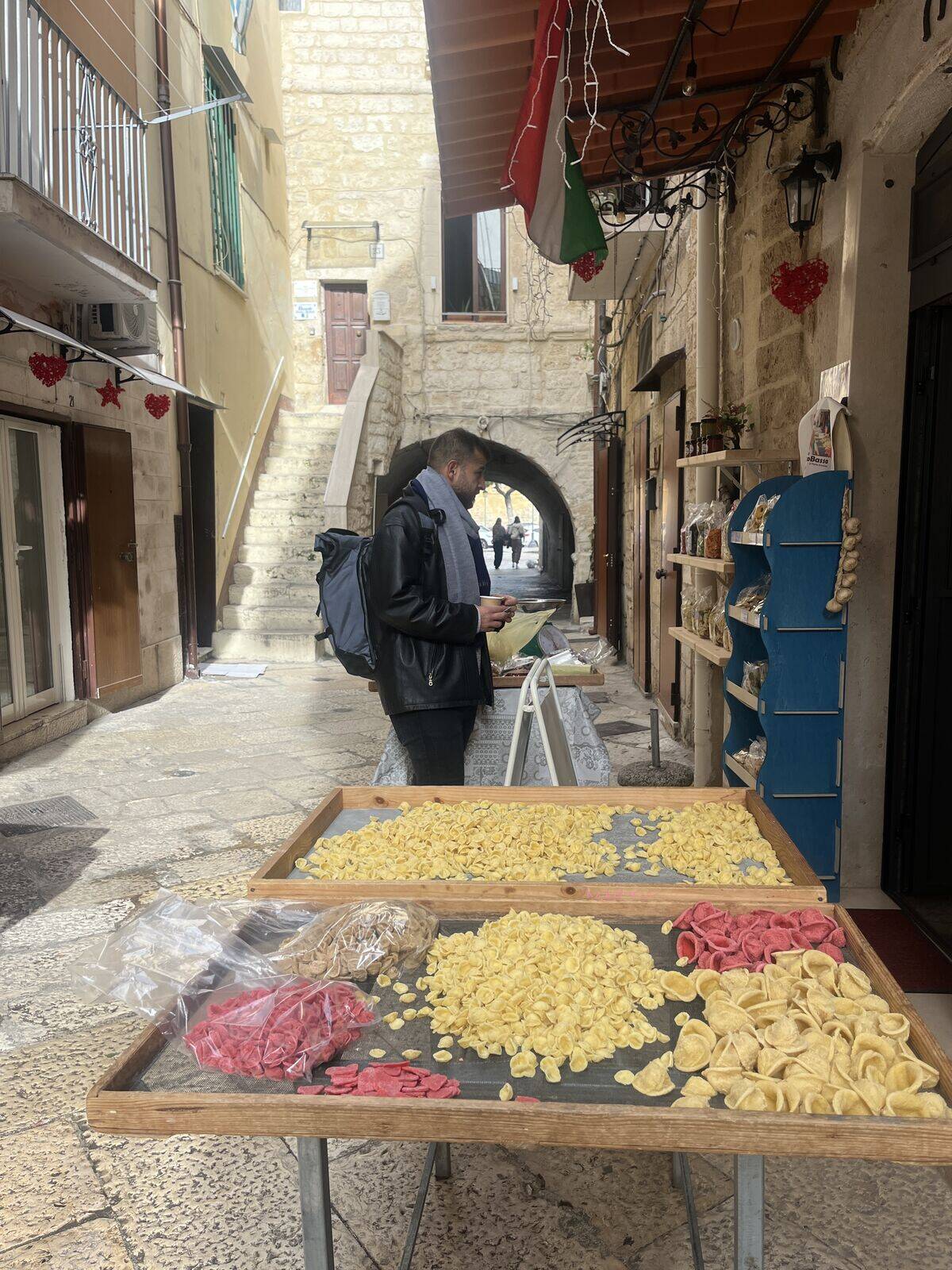 Fresh orecchiette pasta drying in a Puglia alley